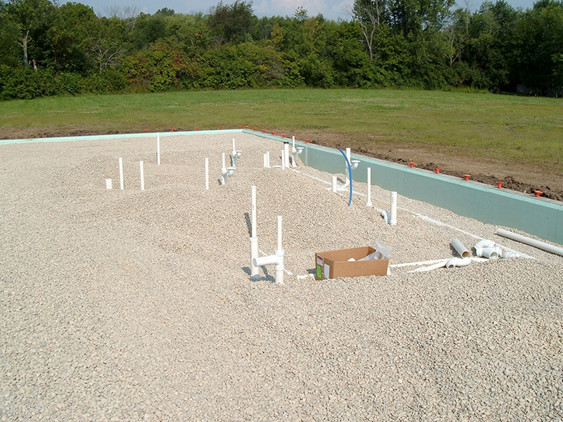 PVC pipe inserted for plumbing with gravel
