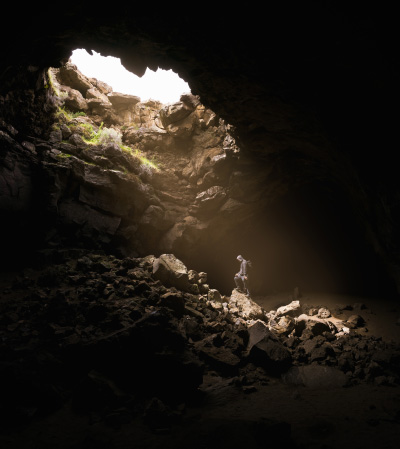 Person in ground cave