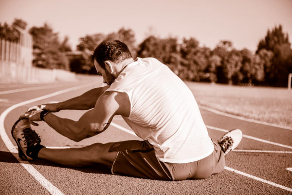 Track Runner Stretching